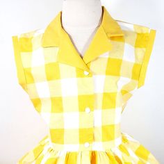 This is an adorable yellow gingham print shirt dress, has a yellow collar and sleeve cuffs. I could also make it out of different fabrics. This dress is shown with an underskirt that can be purchased in my shop for an additional $10. https://www.etsy.com/listing/116097306/tulle-underskirt-made-to-order?ref=shop_home_active Thank you for checking out my listing! Classic Fitted Plaid Summer Dress, Collared Gingham Dresses, Collared Gingham Dress For Spring, Retro Gingham Plaid Cotton Dress, Fitted Collared Gingham Dress, Fitted Gingham Dress With Collar, Fitted Cotton Plaid Dress In Preppy Style, Fitted Plaid Cotton Dress In Preppy Style, Preppy Fitted Plaid Cotton Dress