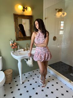 Our 'Kelly' mini dress features a halter tie top, open back, pink floral design, with a drop waist bubble hem skirt. Model is wearing a small Halter Tie Top, Pink Floral Design, Skirt Model, Bubble Hem, Hem Skirt, Tie Top, Drop Waist, Set Dress, Pink Floral