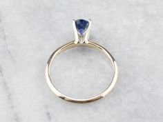 "This is a classic engagement ring with clean lines and great proportions! This ring is quite traditional, featuring a solid gold head to hold the stone securely. Polished yellow gold shoulders complete the simple look. We've set this versatile piece with an intense sapphire, an exquisite cornflower blue that is bright and shining. The value of this gem is found in its quality - this is a benchmark gem, of the ultimate color and clarity that other sapphires can be compared against. Metal: 14K Ye Engagement Ring Classic, Yellow Gold Sapphire Ring, Sapphire Solitaire Ring, Classic Engagement Ring, Gold Sapphire Ring, Classic Engagement, Ring Sapphire, Sapphire Solitaire, Cameo Ring