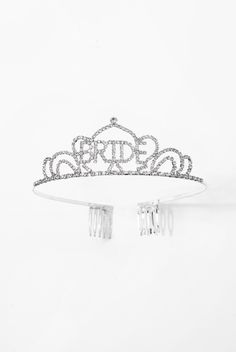 It's finally your day, so why not become the queen of your very own castle? Its elegant and majestic design is attributed to its dazzling rhinestone arrangement around the tiara, as well as its sleek and lightweight structure. Perfect for bridal showers, bachelorette parties, weddings, or any place in need of a queen! SizeLength: 5.5 in (13.97 cm)Width: 1.5 in (3.81 cm) QualityThese 'BRIDE' rhinestone crown tiaras are made with 100% eco-friendly metal alloy and are embellished with sparkly rhine Bride Tiara Bachelorette, Lightweight Structure, Bride Tiara, Bride Bachelorette, Rhinestone Tiara, Rhinestone Crown, Rhinestone Wedding, Bachelorette Parties, Bridal Tiara