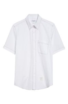 Thom Browne's nametag label and varsity-stripe back tab add signature touches to a short-sleeve cotton shirt traced with contrast topstitching. Front button closure Button-down collar Short sleeves Chest patch pocket Curved hem 100% cotton Dry clean Made in Italy Designer Clothing White Short Sleeve Shirt With Patch Pockets, White Short Sleeve Work Shirt With Pockets, Classic Cotton Short Sleeve Shirt With Patch Pockets, Short Sleeve Shirt With Striped Collar For Work, Classic White Tops With Patch Pockets, White Cotton Short Sleeve Shirt For Work, Contrast Topstitching, Fabric Gifts, Nordstrom Store