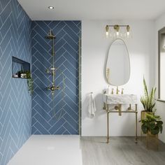 a bathroom with blue and white tiles on the walls, a gold faucet and a mirror