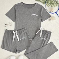 Welcome the weekend with these soft and cozy pj separates. Pieces include a cropped short sleeve top; long, straight leg pant; and 10" short. Pants and shorts have elastic waist. Size Small. Available in Black and Heathered Gray Fabric: 95% Polyester and 5% Elastane Pjs Outfits, Pajama Fashion, Plus Lingerie, Elastic Shorts, Pant Sets, Womens Pyjama Sets, Dress Hats, Round Neck Tops, Pyjama Set