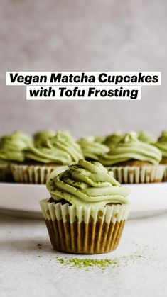 cupcakes with green frosting on a white plate