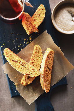 Pumpkin spice biscotti on a slice of parchment paper next to a glass of tea Pumpkin Biscotti, Vegetarian Cookies, Vegetarian Thanksgiving, Biscotti Recipe, Italian Cookies, Thanksgiving Desserts, Pumpkin Dessert, Pumpkin Pie Spice