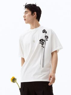 This is a comfortable and trendy t-shirt that is made out of high quality cotton 100% fabric. With design detail of flower print on the front and logo print on the back, it gives a trendy and modern look. - Loose silhouette- Graphic print on the front and back- Ribbed round neckline Relaxed Fit Floral Print T-shirt For Streetwear, Casual Floral Print T-shirt For Streetwear, Streetwear Short Sleeve Floral Print T-shirt, Streetwear Floral Print Crew Neck T-shirt, Streetwear Floral Print Short Sleeve T-shirt, Short Sleeve Floral Print Streetwear T-shirt, Short Sleeve Floral Print T-shirt For Streetwear, Cotton Floral Print Tops For Streetwear, Floral Print Short Sleeve T-shirt For Streetwear