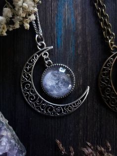 "Witchy moon necklace with your choice of silver or bronze finish, as well as your choice of length. ➳ Moon measures approximately 2\"x2\". ➳ Reference photo chart to determine the length that suits you. ➳ Bronze chain is lead free metal alloy. ➳ Silver chain is stainless steel and suitable for those with allergies to certain metals. ̩̩͙✩*̩̩͙*˚＊ ̩̩͙✩*̩̩͙*˚＊ ̩̩͙✩*̩̩͙*˚＊ ̩̩͙✩*̩̩͙*˚＊ ̩̩͙✩*̩̩͙*˚＊ ̩̩͙✩*̩̩͙*˚＊ ̩̩͙✩*̩̩͙*˚＊ 🌙 The Lunarly Lotus is a new shop but I have been a seller on Etsy for 5 years. Silver Necklace With Moon Charm In Brass, Silver Brass Necklace With Moon Charm, Moon Phase Necklace In Metal, Moon Phase Metal Necklace In Moon Shape, Metal Moon Phase Necklace, Silver Crescent Brass Necklace, Nickel-free Crescent Celestial Necklace, Celestial Bronze Moon Jewelry, Celestial Moon-shaped Bronze Jewelry