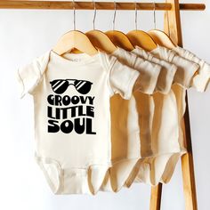 "Groovy Little Soul, Pregnancy Announcement Onesie®, Retro Kids Shirt, Kids Birthday Tee, Boho Kids Shirts, Cute Toddler Shirt, Newborn Gift HOW TO ORDER * Please review all the information provided before placing an order. 1. Select the style and size using the drop-down menu. 2. Select color 3. [APPLICABLE ONLY ON CERTAIN LISTINGS] Follow the instructions to fill out the \"Add your personalization\" option, e.g., specifying custom sayings or selecting design colors. 4. Select quantity Need mor Cricut Sweaters, Announcement Onesie, Pregnancy Announcement Onesie, Shirts Cute, Retro Kids, Boho Kids, Birthday Tee, Newborn Gifts, Pregnancy Announcement