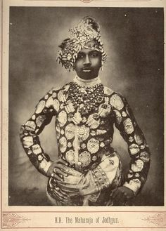 an old black and white photo of a man in costume