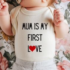 Mum is my first love onepiece romper, valentines day gift mum, pregnancy reveal one piece, baby surprise top, gift for new mum,  Color: Natural and white Packaging:  The item will be folded and individually package into resealable clear poly bags. It will then be placed inside a white polymail bag to be shipped to you. Material:  100 % cotton  Regular fit, midweight 180 gsm  preshrunk to minimise shrinkage Washing Instruction: Wash the T Shirt before wearing it. Cold, gentle wash setting with like colours only Flip the shirt inside out before washing Do not tumble dry Do not use harsh detergents or bleach Do not dry clean Warm iron, inside out This shirt is made in Australia. Please check our shop for more T shirts. Please leave us a review to help our shop grow. Cute Onesie With Letter Print For Gift, Cute Cotton Onesie For Mother's Day, Cute Short Sleeve Bodysuit For Gift, Cute Short Sleeve Bodysuit As Gift, Cute Letter Print Bodysuit Perfect As A Gift, Cute Letter Print Bodysuit As A Gift, Cute Letter Print Bodysuit As Gift, Cute Onesie With Name Print As A Gift, Cotton Bodysuit With Letter Print As Gift