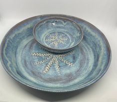 two blue plates with snowflakes on them