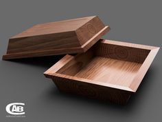 two wooden boxes sitting side by side on top of each other with the lids open