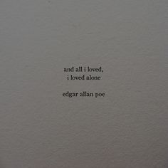 an old typewriter with the words and all i loved, i loved atone edgar allen poe