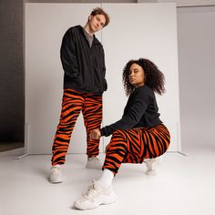 The unisex track pants are your new go-to piece for working out or styling a streetwear outfit. The water-resistant, lightweight fabric and mesh lining provide comfort, while elastic ankle cuffs will make it easy for you to show off your kicks. Style it with a windbreaker for a complete look and feel. * 100% polyester * Fabric weight: 2.21 oz/yd² (75 g/m²) * Lightweight, water-resistant fabric * Fully lined, mesh lining  * Relaxed fit * Elastic waistband and ankle cuffs * Drawcord * Zip pockets * Sits at hip * Blank product sourced from China Sportswear Sweatpants With Elastic Cuffs For Streetwear, Sporty Sweatpants With Elastic Cuffs For Streetwear, Sporty Streetwear Joggers With Elastic Cuffs, Athleisure Streetwear Joggers With Elastic Cuffs, Athleisure Joggers With Elastic Cuffs For Streetwear, Spring Streetwear Joggers With Elastic Cuffs, Hip Hop Sweatpants For Jogging, Hip Hop Sweatpants With Elastic Waistband For Jogging, Hip Hop Style Sweatpants With Elastic Waistband For Jogging