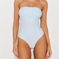 Brand New Never Worn Chic Blue Strapless Swimwear, Summer Bandeau Bodysuit For Beachwear, Blue Seamless Bodysuit For Pool, Seamless Blue Bodysuit For Pool, Summer Strapless Bodysuit For Beach, Spring Strapless Bodysuit, Strapless Bodysuit For Beach In Spring, Strapless Bodysuit For Spring, Strapless Bodysuit For Poolside Summer