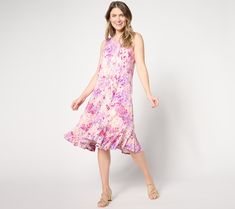 Who's that lovely lady? Everyone will be asking as you whoosh by in this ruffled tank dress. The perfect complement to your summer social scene, this party-ready piece is a carefree confident look that won't go unnoticed. From LOGO by Lori Goldstein®. Sleeveless Ruffled Dress For Summer Garden Party, Summer Sleeveless Ruffled Dress For Garden Party, Casual Sleeveless Dress With Ruffle Hem For Spring, Feminine Summer Midi Dress With Ruffle Hem, Summer Feminine Midi Dress With Ruffle Hem, Summer Garden Party Midi Dress With Ruffle Hem, Spring Beach Sleeveless Dress With Ruffle Hem, Knee-length Ruffled Sleeveless Summer Dress, Sleeveless Ruffled Knee-length Dress For Summer