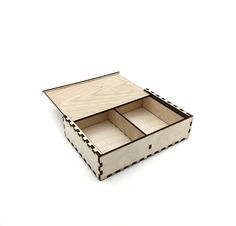 an open wooden box with two compartments