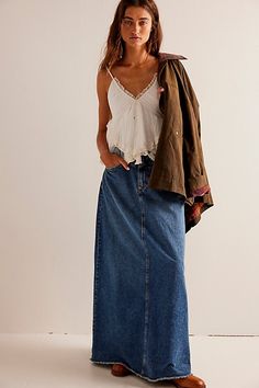 Forever cool and classic denim maxi from our We The Free collection. **Fit:** Mid-rise, A-line silhouette and rigid denim **Features:** Zip fly and button closure, four-pocket design, inverted yoke seam at front, raw-edge hem **Why We | We The Free Come As You Are Denim Maxi Skirt at Free People in Dark Wash, Size: US 6 Long Denim Skirt Outfit, Maxi Jean Skirt, Jean Skirt Outfits, Long Jean Skirt, Denim Skirt Outfits, Long Denim Skirt, Maxi Skirt Outfits, Denim Maxi, Free People Skirt