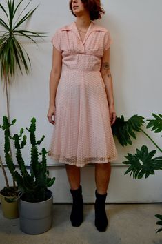 "Fifties Pink Party Dress. Textured Overlay. Wing Collar. Midriff Yoke Waistline. Metal Zipper Closure Up Side. Shoulder Pads. Lined. No Content Label, Feels Synthetic Good Vintage Condition - General Wear. Discolouration and Stains Around Hem. Seam Rip Above Zipper. Faint Armpit Stains. Some Rips In Overlay. Fits Size Small Chest - 36\" Waist - 28\" Hip - 40\" Shoulder to Hem - 42.5\" All Sales Are Final. We have taken the time to note all size measurements and the condition of each piece so pl Vintage V-neck Party Dress, Vintage V-neck Dress For Garden Party, Retro V-neck Wedding Dress, Retro V-neck Dress For Garden Party, Vintage Fit And Flare V-neck Dress, Vintage V-neck Fit And Flare Dress, 1950s Style Knee-length Party Dress, Retro Knee-length Vintage Dress For Party, 1950s Style Fit And Flare Party Dress