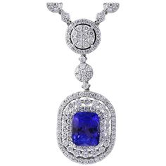 7 carats of fine quality of Cushion Shape Tanzanite pendant surrounded by brilliant round cut Diamonds all mounted in 18 karat White gold. Weight of the necklace is 24 Grams . Tanzanite Weight Approximately 7 Carats Diamond Weight Approximately 12.38 Carats 18 K gold Weight 24 Grams Very affordable price for this particular piece. FOLLOW MonalisaJewelry Inc. storefront to view the latest collection. We encourage you to take a look at all the pictures provided for this item. As it can be difficul Luxury Tanzanite Necklace With Brilliant Cut, Exquisite Gemstone Diamond Necklace For Formal Events, Exquisite Gemstone Diamond Necklace For Formal Occasions, Luxury Oval Tanzanite Necklaces, Formal Sapphire Diamond Necklace With Brilliant Cut, Classic Sapphire Diamond Necklace For Formal Occasions, Formal Sapphire Pendant Diamond Necklace, Classic Sapphire Necklace For Formal Occasions, Classic Formal Sapphire Diamond Necklace