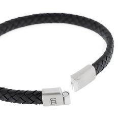 This braided leather bracelet embodies unwavering strength and reliability. Featuring a branded metal clasp, it ensures a secure and comfortable fit around the wrist. This slim, elegantly braided bracelet is the quintessential stylish leather accessory.- WIDTH: 6 mm- MATERIAL TYPE: 100% genuine Cowhide leather- CLASP COLOR: Brushed silver- CLASP MATERIAL: 316L stainless steel- CLASP TYPE: Magnetic Leather Accessory, Braided Leather Bracelet, Braided Bracelet, Bracelet Black, Braided Leather, Leather Accessories, Cowhide Leather, Leather Bracelet, Braids