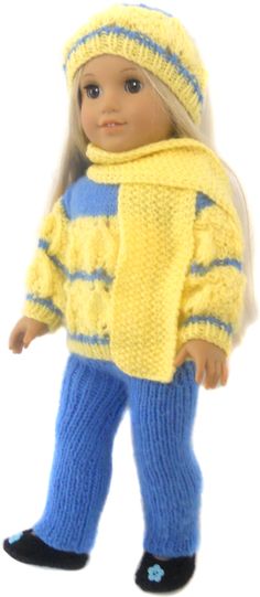 a doll is wearing a yellow sweater and blue pants