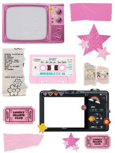 an old fashioned pink camera surrounded by various items such as paper, tape and stickers