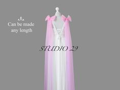 a white dress with pink ribbon on it and the words can be made any length