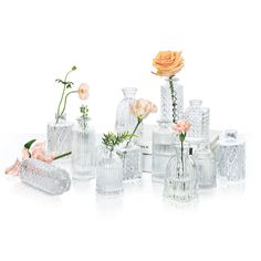 a group of vases with flowers in them