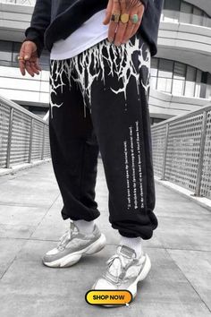 The Demon's Blood Casual Track Pants redefine streetwear with a bold and edgy style. Featuring a unique design inspired by rebellious energy, these track pants offer both comfort and a statement look. Step into the urban realm with confidence, as these pants become a symbol of your distinctive fashion sense. Baggy Graphic Print Bottoms For Streetwear, Black Straight Leg Sweatpants With Letter Print, Winter Graphic Print Bottoms For Streetwear, Straight Leg Bottoms With Graphic Print For Streetwear, Graphic Print Bottoms For Winter Streetwear, Straight Leg Graphic Print Bottoms For Streetwear, Graphic Print Straight Leg Bottoms For Streetwear, Graphic Print Bottoms For Streetwear In Winter, Streetwear Wide Leg Bottoms With Graphic Print