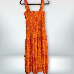 Umgee Size L 100% Polyester Nwt Step Into Summer With This Striking Umgee Dress, Boasting A Vivid Orange And Pink Floral Print That’s Sure To Turn Heads. This Dress Features An Elastic, Smocked Bodice For A Snug And Flattering Fit, Coupled With Adjustable Straps To Ensure Perfect Comfort. The Tiered Skirt Adds A Playful Touch, Making It Ideal For Both Day Events And Casual Evenings Out. A Must-Have For Your Seasonal Wardrobe, This Dress Combines Both Style And Ease. Pink Tiered Midi Dress With Smocked Back, Tiered Smocked Dress With Floral Print For Beach, Pink Summer Dress With Elastic Neckline, Multicolor Smocked Bodice Sundress For Brunch, Multicolor Smocked Bodice Sundress, Pink Tiered Smocked Dress With Floral Print, Pink Tiered Smocked Dress With Smocked Back, Pink Vacation Dress With Elastic Neckline, Pink Dress With Elastic Neckline For Vacation