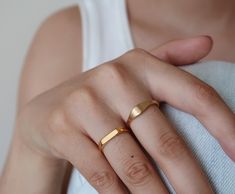 "* Check out this ring too! A great option for stacking: https://www.etsy.com/listing/1000088417/18k-gold-filled-band-ring-vintage-matte?ref=listing_published_alert This band ring is made of titanium steel and 18k gold filled. Titanium steel can hold up well to regular wear without deteriorating. 18k gold-filled finish means a much thicker coating than normal 14k gold plated. Please note these rings are water-resistant. It won't turn your skin green. To keep the color lasting longer, I would avo Little Finger Ring, Simple Ring Band, Rectangular Ring, Minimal Ring, Simple Ring, Geometric Ring, Gold Filled Ring, Ring Stacking, Everyday Rings