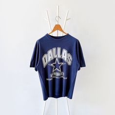 90s Dallas Cowboys NFL t-shirt/ L * PLEASE READ BEFORE PURCHASE * PLEASE consider the PHOTOS before making the decision * The images may DIFFER in appearance from the actual product because we took pictures under daylight.  * PLEASE send your PHONE NUMBER after your purchase for the shipping company to contact you X No returns X No refund Condition : 8/10 More details : look at the pictures  Brand :  Size : L Pit to pit/ Chests : 22/44 inches  Length : 28 inches  Material : cotton  Color : blue * ALL ITEMS are VINTAGE which may show some signs of wear and tear * Due to the different display and different light, the picture may not reflect the actual color of the item * Please, remember that our items are vintage so they may show some signs of wear, tear and yellow stains. Thank you RE/11/1 Vintage Dallas Cowboys Shirt, Dallas Cowboys Outfits, Vintage Dallas Cowboys, Dallas Cowboys Tshirts, Dallas Cowboys Shirts, Cowboys Nfl, Nfl T Shirts, Cowboys Shirt, Shipping Company