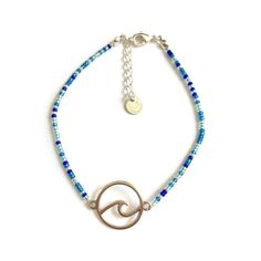 Life's a beach. Enjoy the waves.Anklet with mixed blue tiny glass seed beads and a silvertone wave charm. The diameter of the wave charm measures approximately 20mm (13/16").The anklet has a small extension chain, so you can adjust the length a bit.Every Flor anklet has a handstamped brand tag.****************************************I am happy to make the anklets to size. After placing your order you will therefore receive a message with instructions on how to measure the ankle circumference. If Blue Tiny Beads Anklet For Gift, Blue Anklet With Tiny Beads For Gift, Blue Beach Anklets With Round Beads, Adjustable Blue Anklets For Beach, Blue Beaded Ocean-inspired Anklet, Brand Tags, Beaded Anklets, Beaded Choker Necklace, Blue Waves