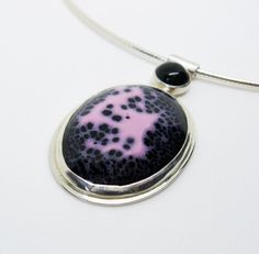 This sterling silver necklace is exquisitely enamelled in pink and black with a black onyx detail in the bail. The focal enamelled element features a beautiful constellation of black and pink colors which I've bezel set in sterling and fine silver with a bee cutout in the back. The bail is a sterling silver tube with a bezel set black onyx which is riveted to the back of the focal piece. The chain is a 16" italian silver omega necklace.This is a fun and unique abstract piece.Browse the Gracebour Bee Cutout, Omega Necklace, Enamel Necklaces, Black Abstract, Black And Pink, Pink And Black, Fine Silver, Black Onyx, Sterling Silver Necklaces