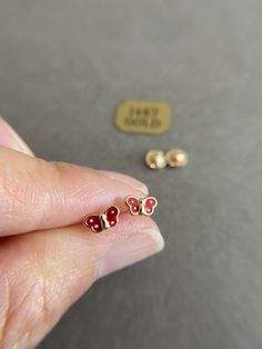 SCREW BACK/14K Solid Gold Butterfly Stud Earrings- 14K Solid Gold Quantity: One Pair Color : Red / Pink Materials : 14K Solid Gold Size : 3.5mm * 6mm *14K Solid Gold will not tarnish. *Good for sensitive skin. * Metal components are 14K Solid Gold including earring backs. * Suitable for delicate and sensitive ears. * Comes in a jewelry box. If you need extra boxes for gifting....just let us know! Red 14k Gold Pierced Earrings, 14k Gold Red Earrings For Pierced Ears, Red Hypoallergenic Dainty Earrings, Hypoallergenic 14k Gold Red Jewelry, Dainty Red 14k Gold Earrings, Red 14k Gold Earrings For Anniversary, Red 14k Gold Earrings, Butterfly Earrings Gold, Butterfly Stud Earrings