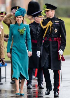 the duke and princess of cambridge are walking down the street in their official dress uniform