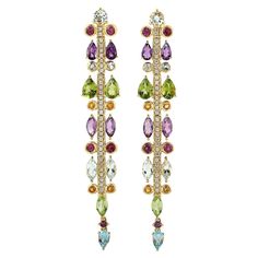 These multi gemstone earrings are true stunners. Handcrafted of 18K gold, set with 4.78 carats Peridot, 1.59 carat Amethyst, .35 carat Citrine and .52 carat sparkling diamonds. FOLLOW MEGHNA JEWELS storefront to view the latest collection & exclusive pieces. Meghna Jewels is proudly rated as a Top Seller on 1stDibs with 5 star customer reviews. All items manufactured by us are handmade and can be customized or redesigned. Composition Size-67X11 MM Total Weight-14.03 Gold Weight(Gms)-12.492 Diamo Yellow Gold Drop Earrings, Gem Earrings, Gold Diamond Earrings, Diamond Drop Earrings, Fabulous Jewelry, Wood Earrings, Gold Drop Earrings, Top Seller, Gold Set