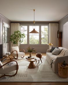 a living room filled with furniture and a flat screen tv