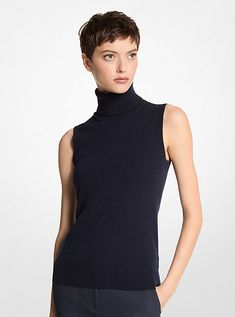 Crafted from luxe Italian cashmere, this sleeveless sweater is a wardrobe must-have that will stand the test of time. The lightly ribbed trim adds subtle texture, while the figure-flattering fit ensures easy layering. Wear it with trousers in a complementary hue. Sleeveless Cashmere Top For Layering, Fine Knit Sweater Vest For Work, Sleeveless Cashmere Sweater Vest For Layering, Elegant Fine Knit Fitted Sweater Vest, Elegant Fitted Fine Knit Sweater Vest, Elegant Sleeveless Cashmere Tops, Sleeveless Cashmere Tops For Work, Classic Cashmere Sweater Vest For Layering, Elegant Fine Knit Sweater Vest For Fall