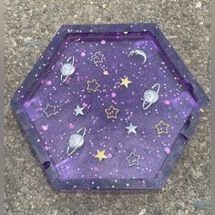 a purple tray with stars and planets painted on it