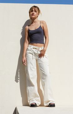 Step out in style with the Bone Low Rise Baggy Flare Pants from PacSun. Designed for both comfort and utility, these pants feature a low-rise fit, ribbed drawstring waistband, and zipper side pockets. Complete with cargo strap pockets on the legs and flared leg openings, they offer a trendy, relaxed baggy look for any occasion. Slim Fit Cargo Pants, Pacsun Pants, Low Rise Pants, Dad Jeans, Curve Jeans, Trouser Pants Women, Jeans Kids, The Bone, Kids Swimwear