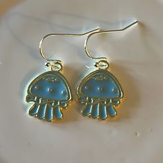 Jellyfish Earrings Made With Enamel An Silver Plated Earwire. *3/4” Jellyfish *Silver Plated Earwire Blue Drop Earrings With Fish Hook, Blue Fish Hook Earrings For Gift, Blue Dangle Earrings With Ocean-inspired Style, Gift Blue Fish Hook Earrings, Ocean-inspired Blue Dangle Earrings, Whimsical Blue Round Jewelry, Whimsical Round Blue Jewelry, Ocean-inspired Blue Earrings With Ear Wire, Ocean-inspired Blue Earrings For Gifts