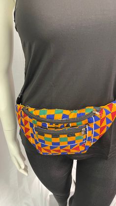 Crafted  with vibrant Kente fabric, this stylish fanny bag features three zipper pockets for convenient storage of your essentials. The adjustable waistband ensures a perfect fit, combining fashion and functionality seamlessly. Elevate your style with this unique and culturally inspired Fanny Pack. Casual Multicolor Pouch Belt Bag, Multicolor Belt Bag With Pockets For Everyday Use, Casual Multicolor Chest Bag For Travel, Casual Multicolor Chest Bag For Everyday Use, Trendy Multicolor Pouch Belt Bag, Multicolor Zipper Pouch Belt Bag For Travel, Kente Fabric, Kente Print, Fanny Bag