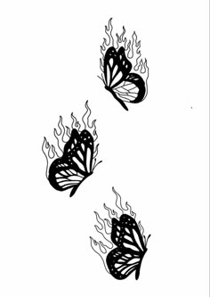 three black and white butterflies flying in the air with flames coming out of their wings