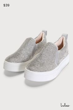 Your classic sneaker gets a major upgrade with the Lulus Cassay Silver Rhinestone Platform Slip-On Sneakers! Shiny silver rhinestones dance across these slip-on sneakers that have a rounded toe upper and elastic gussets for fit. Pull tab at back. 1.5"" white bumper sole. 1. 5" platform rubber heel. Lightly cushioned insole. Rubber sole has nonskid markings. All Man Made Materials. Imported. Lulus | Cassay Silver Rhinestone Platform Slip-On Sneakers. Slip-on Synthetic Sneakers With Rhinestones, Silver Rhinestone Sneakers With Round Toe, Silver Low-top Sneakers With Bling, Silver Bling Low-top Sneakers, Silver Rhinestone Low-top Sneakers, Silver Embellished Sneakers With Round Toe, Silver Sparkling Sneakers With Round Toe, Silver Embellished Round Toe Sneakers, Party Sneakers With Silver Rhinestones