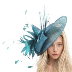 Hats By Cressida Kentucky Derby Ascot Fascinator Hats Teal Adonis Sinamay & Feather Saucer Hatinator Fascinator Hat Teal sinamay swirls trimmed with a mass of feathers and curled burnt feathers on a large teal sinamay base The hat base measures about 12 inches wide This teal fascinator is mounted with matching headband If you prefer a headband to match your hair, please make a note at check out what colour headband you want. For those who love to make a statement, the Adonis Fascinator Hat is a perfect choice. This headpiece was designed to add a touch of elegance and glamour to formal events, making it a must-have for those attending Royal Ascot or other hat-centered race events in Melbourne. Featuring a gorgeous saucer disc and an intricate feather arrangement, it is also a popular choic Luxury Turquoise Party Hat, Light Blue Headpiece For Royal Ascot Party, Blue Structured Crown Hat For Spring, Light Blue Mini Hat For Kentucky Derby Party, Blue Spring Hat With Structured Crown, Spring Blue Hat With Structured Crown, Elegant Light Blue Headpiece For Party, Blue Hat Fascinator For Garden Party, Blue Fascinator For Royal Ascot Garden Party