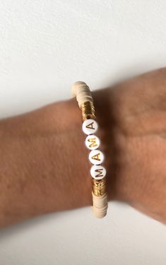 "Orders will be shipped next week and can not be ready for Mother s day. Custom Heishi bracelets are beautiful gift for everybody. 6 mm. Heishi beads in different colors, brushed gold plated discs and custom name will be used or you can prefer no name. Gold plated plain bracelet looks very chic. ❣️To know your size please measure your wrist with a ribbon/string and measure this with a ruler. Add 0.25\". Size:6.25\" - 6.5\" - 6.75\" - 7\" - 7.5\" - 8\" Kid size is available such as 5.5\" and you Gold Heishi Beads Bracelets As Gift, Gold Heishi Beads Bracelet Gift, Customizable Gold Beaded Bracelets, Personalized Gold Heishi Beads Stretch Bracelet, Gold Heishi Beads Name Bracelet As Gift, Personalized Gold Heishi Beads Bracelets, Plain Bracelet, Heishi Bracelets, Heishi Bracelet