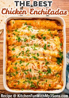 the best chicken enchiladas recipe in a white casserole dish on a wooden table