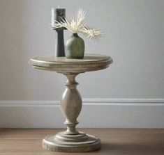 two vases sitting on top of a wooden table